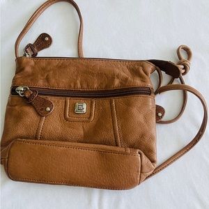 Small Crossbody pocketbook with compartment’s inside and zipper pocket outside.